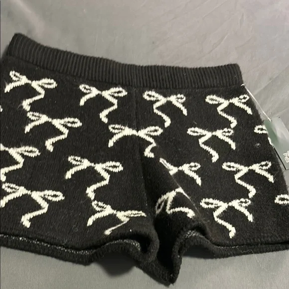 Wilf Fable Black Shorts with White Bow Design - Picture 1 of 5